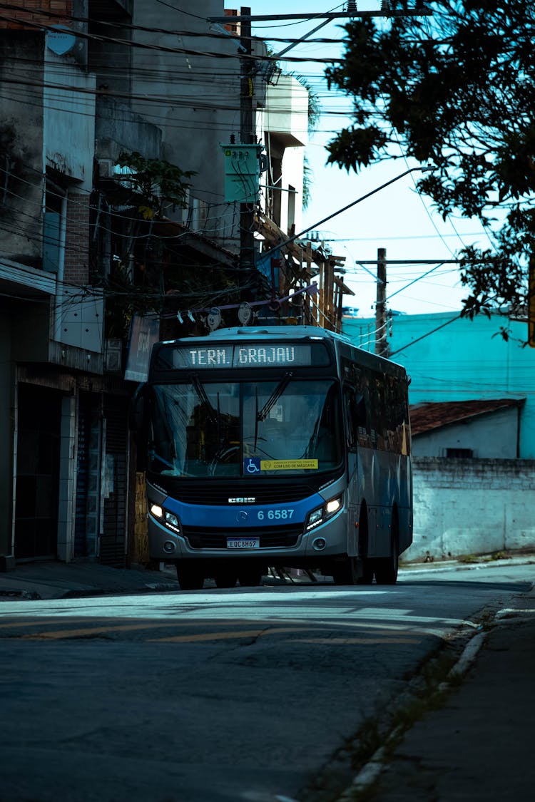 A Blue Bus On The Road