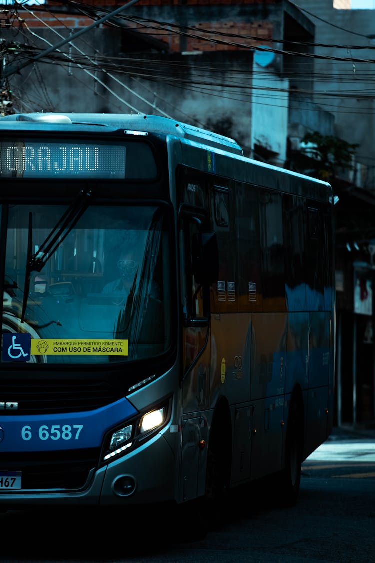 A Blue Bus On The Road