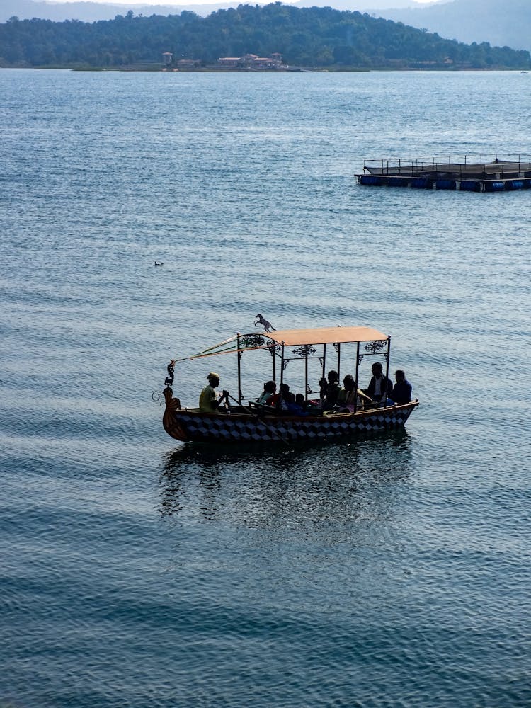 People Riding A Boat On The Sea