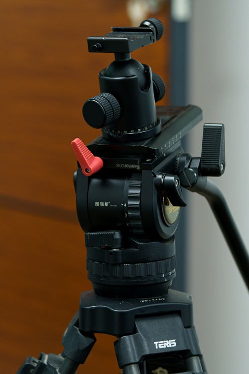 Free Detailed close-up of a professional tripod head used in photography, showcasing precision engineering. Stock Photo