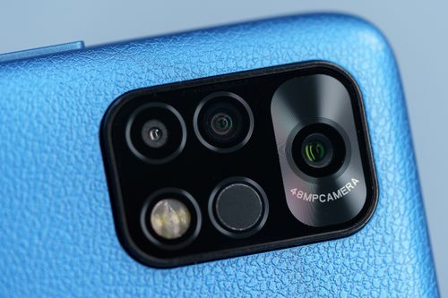 Free Detailed macro shot of a modern smartphone with a 48MP camera lens showcasing its technology. Stock Photo