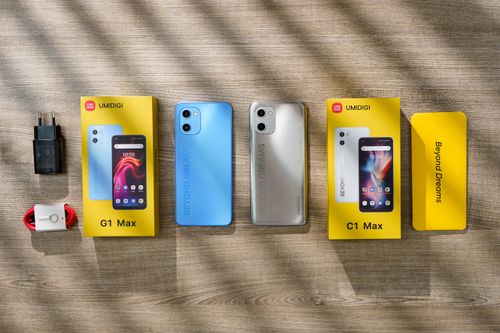 Free High-quality top view of UMIDIGI G1 Max and C1 Max with accessories on a wooden table. Stock Photo