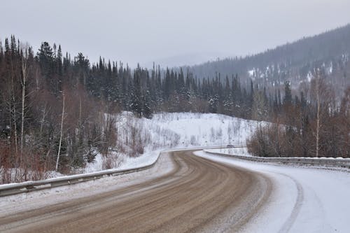 Road in Snow in Mountains Landscape