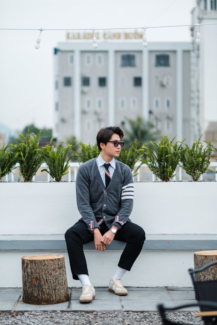 Man In Sweater Sitting