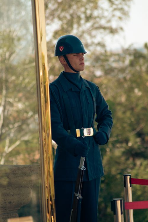 Free A soldier in uniform stands outdoors, showcasing authority and vigilance. Stock Photo