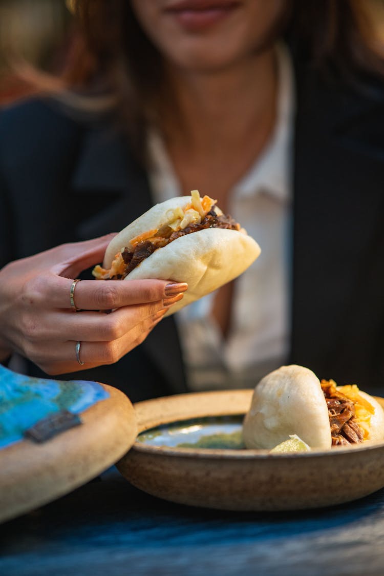 Burger In Woman Hand