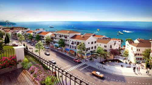 Free A vibrant seaside town with a lively promenade, overlooking the ocean. Stock Photo