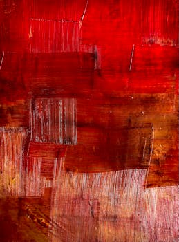 Dynamic red and orange abstract oil painting texture with bold brush strokes.