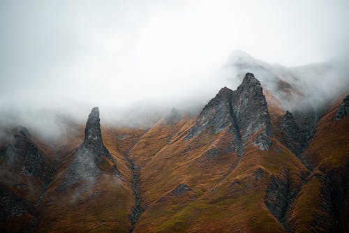 Free Rocky Mountain Surrounded by Fog Stock Photo