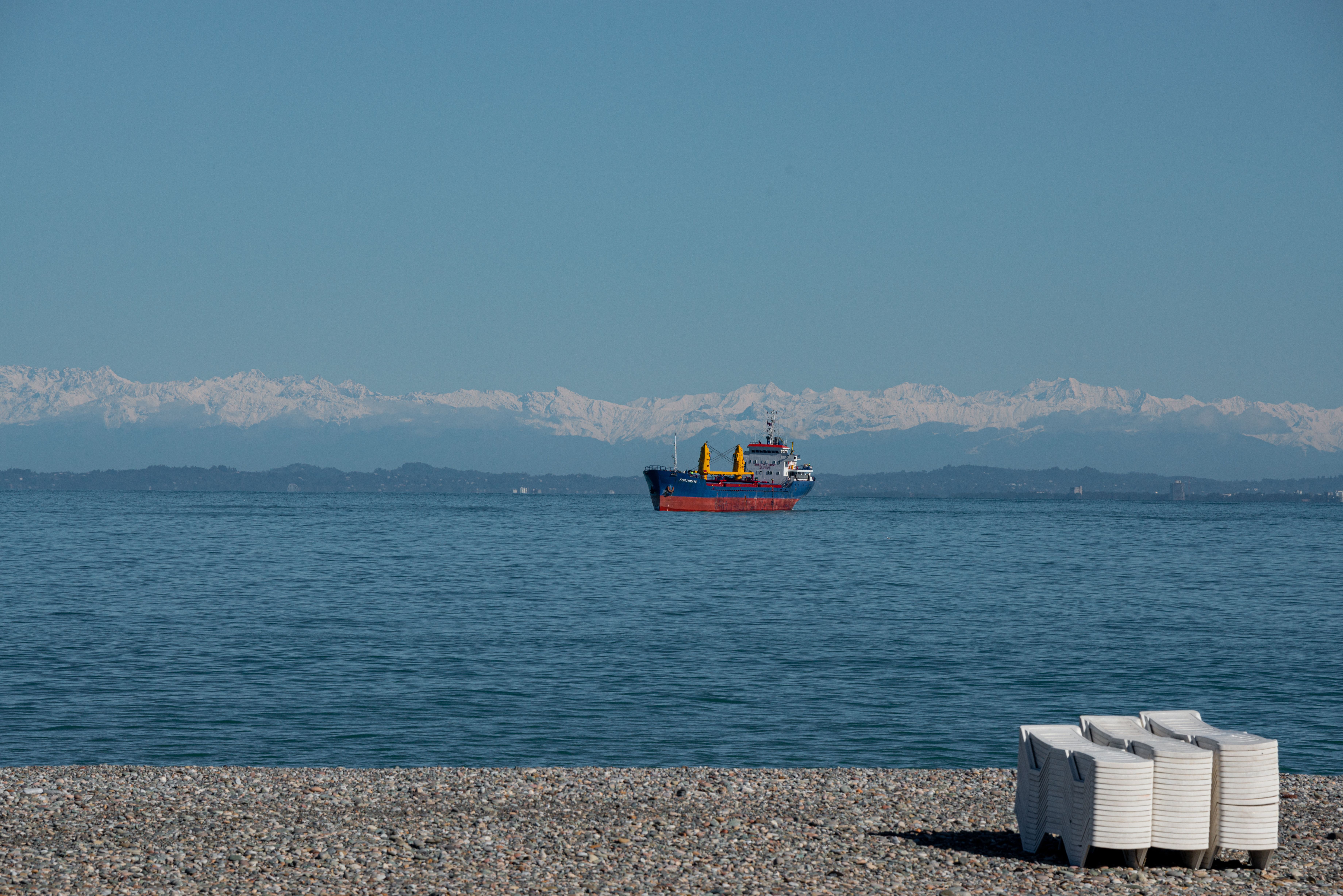 A Cargo Ship Sailing on the Sea Under Blue Sky · Free Stock Photo