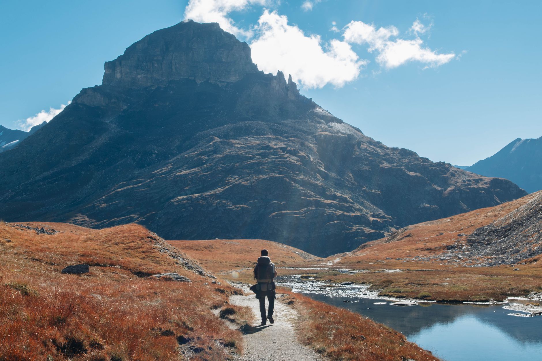 hiker walking mountain wilderness