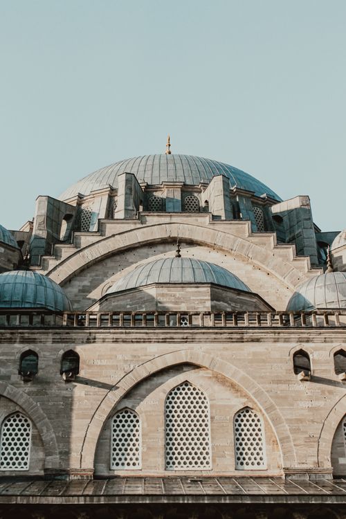Free Detailed view of a Byzantine-inspired mosque dome under a clear sky, showcasing intricate architecture. Stock Photo