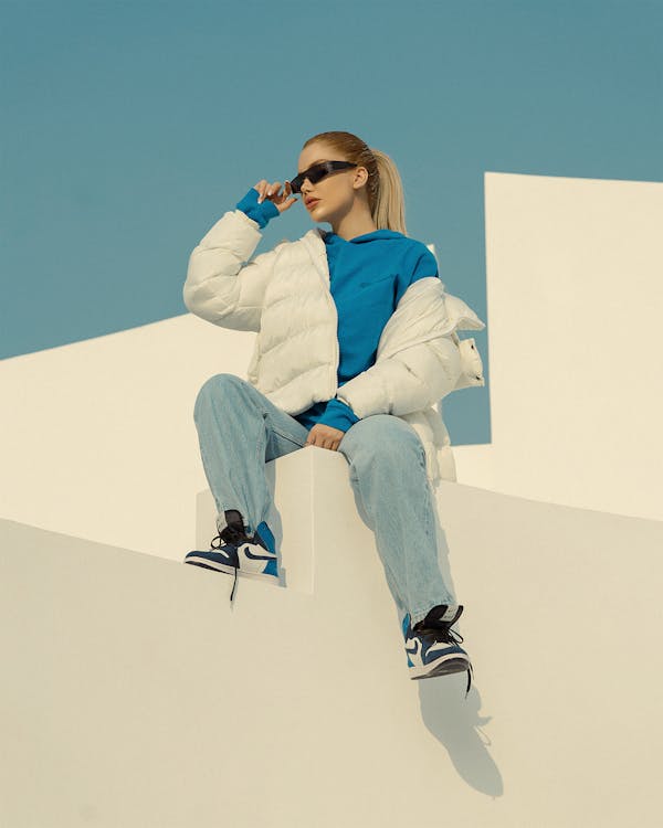 Portrait of a Blonde Sitting on a Step