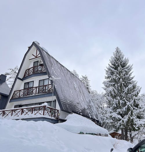 A House in Mountains in Snow 