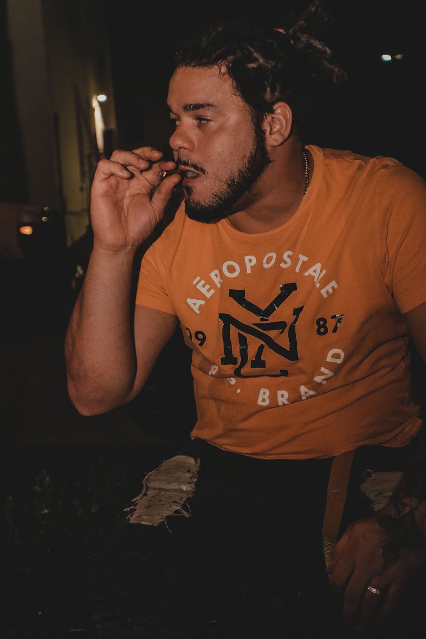 photo of man smoking blunt