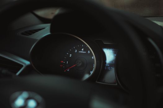 Interior of a car showing a detailed view of the speedometer and tachometer gauges.