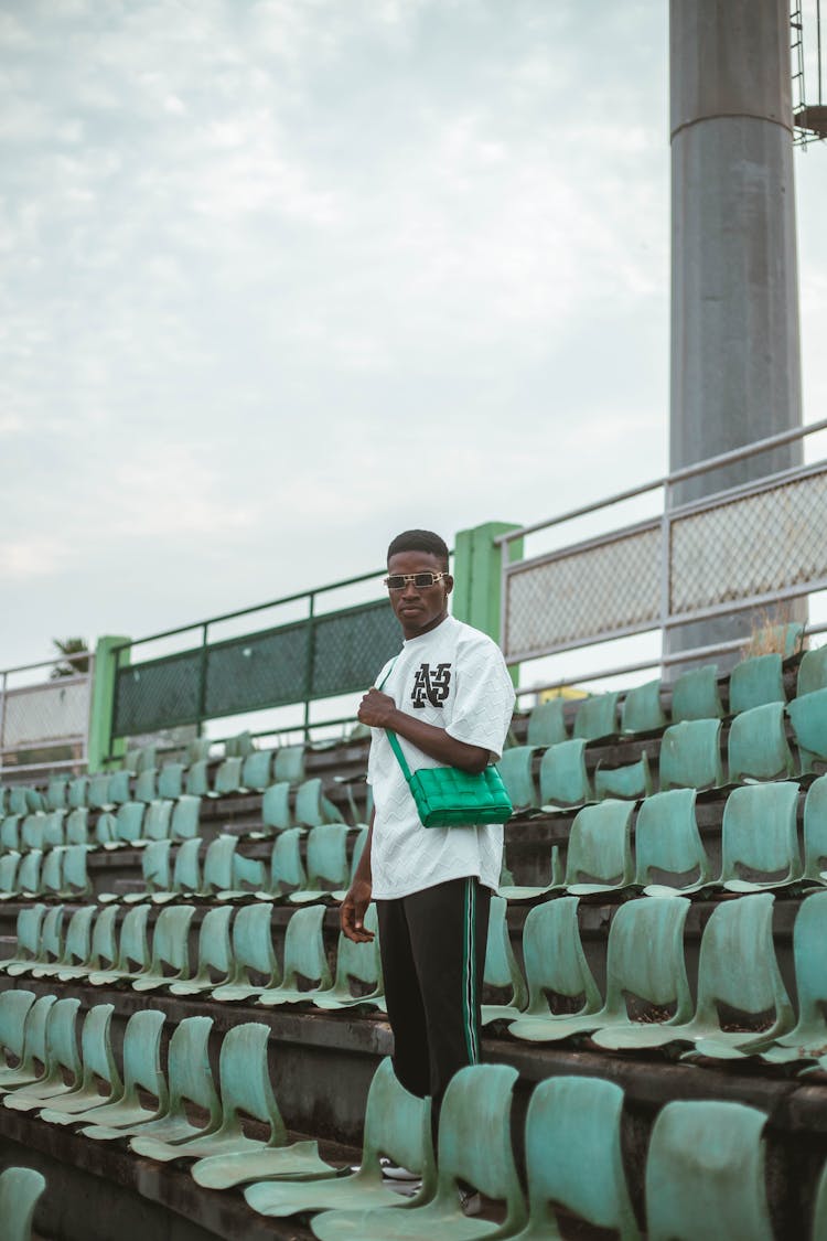 Man Standing In An Empty Stadium 