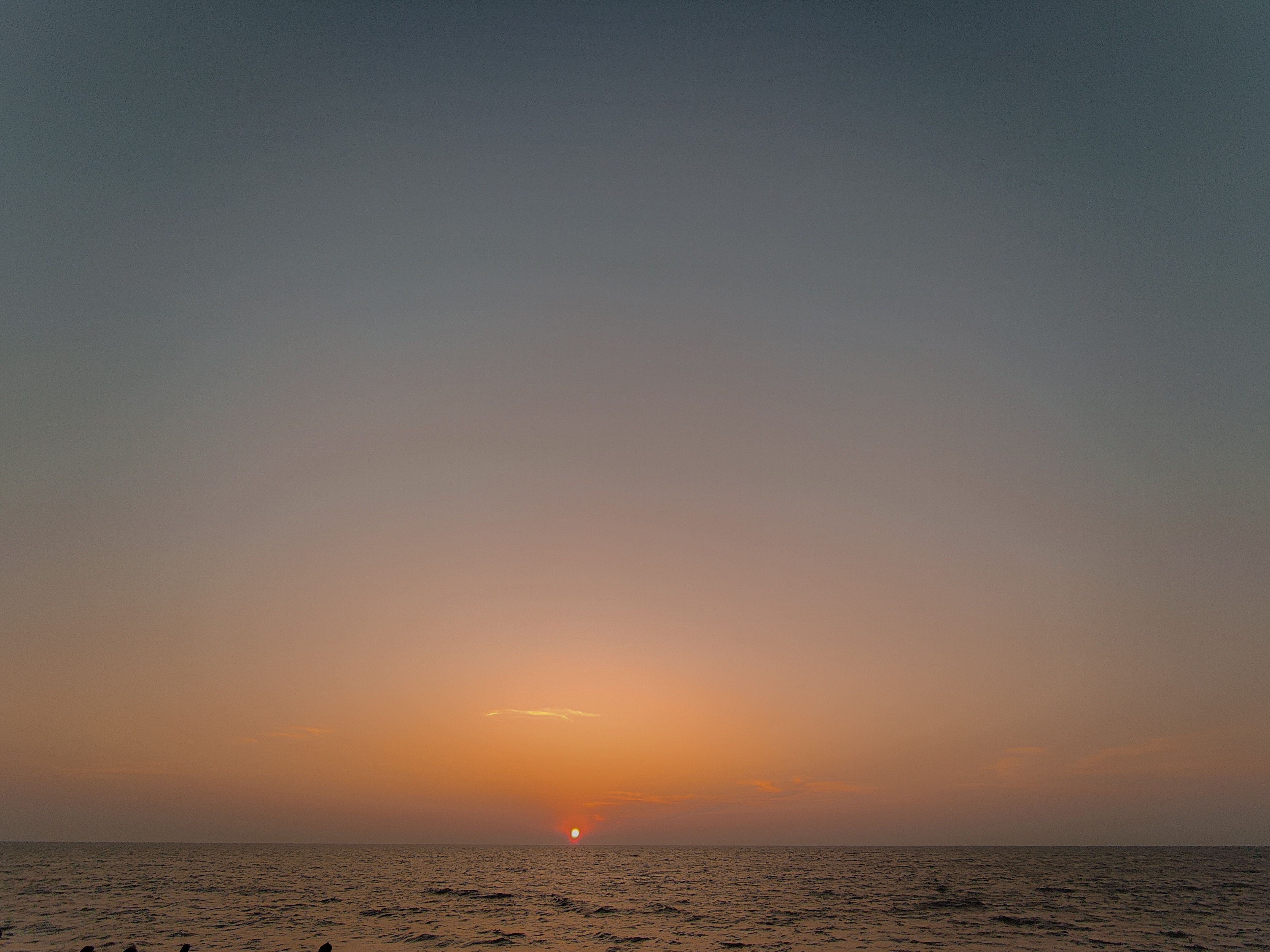 Beautiful sunset view over the Arabian Sea in Kochi, India with vibrant skies.
