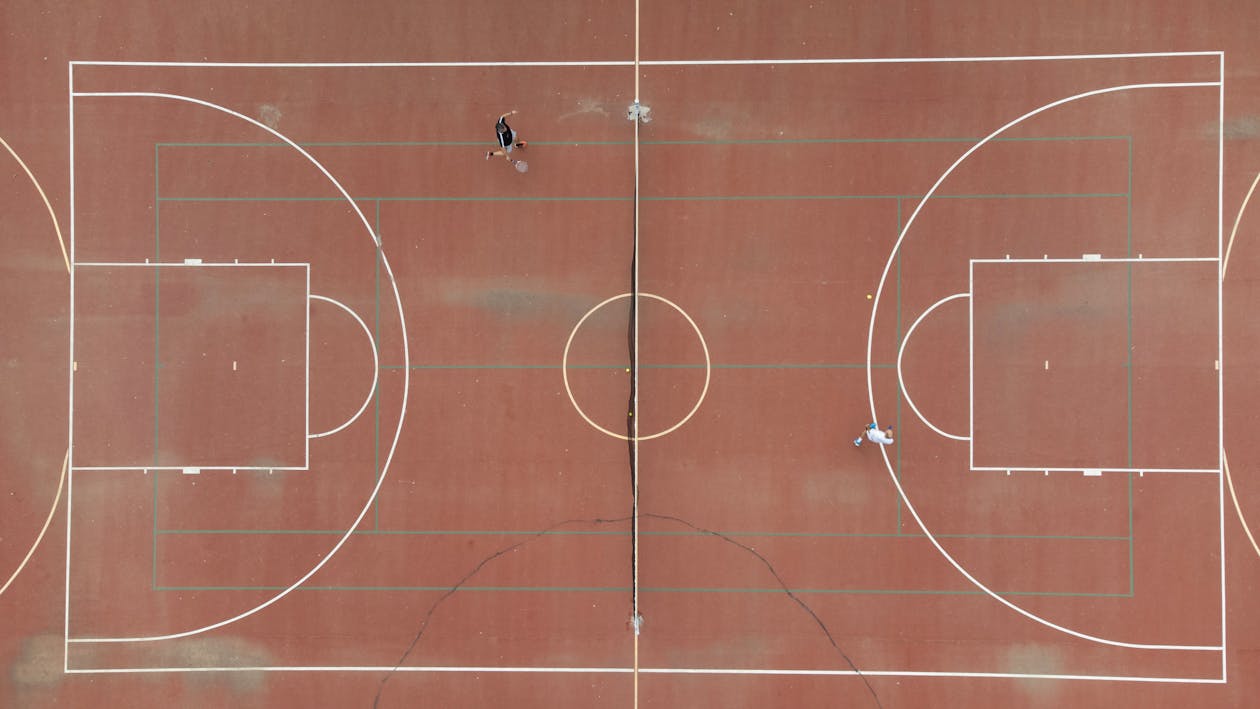 Drone Photography of Men Playing Tennis 
