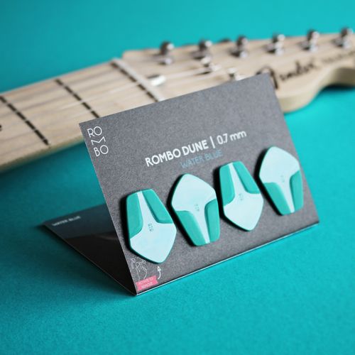 Free Close-up of vibrant guitar picks with a fretboard in the background. Stock Photo