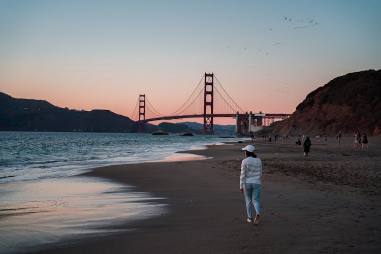 People On Beach, Golden Gate Bridge In Background, San Francisco, USA