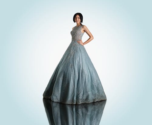 A Woman in Gray Ball Gown Posing at the Camera