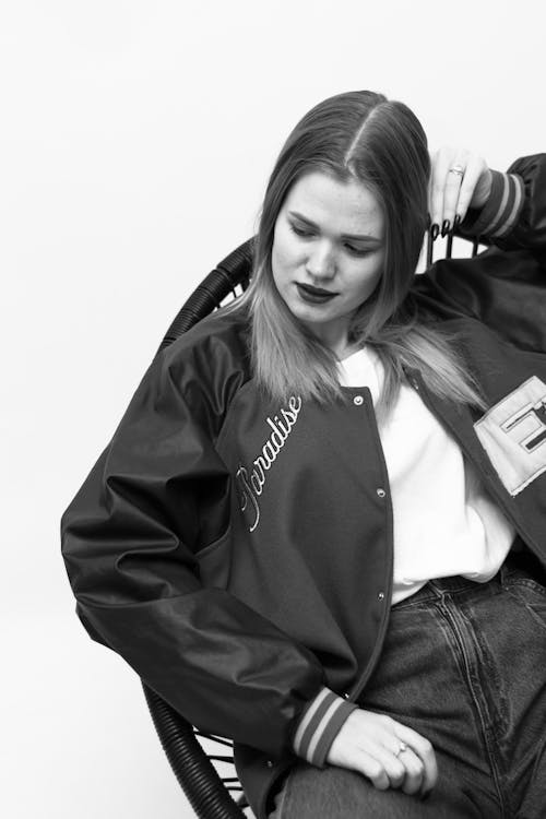 Black and White Photo of Woman Wearing Jacket