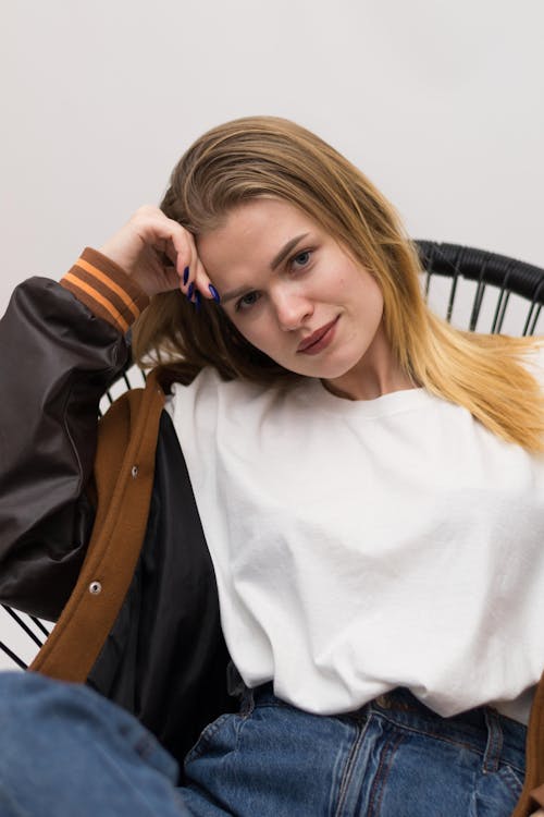 Portrait of a Young Woman Sitting on a Chair 