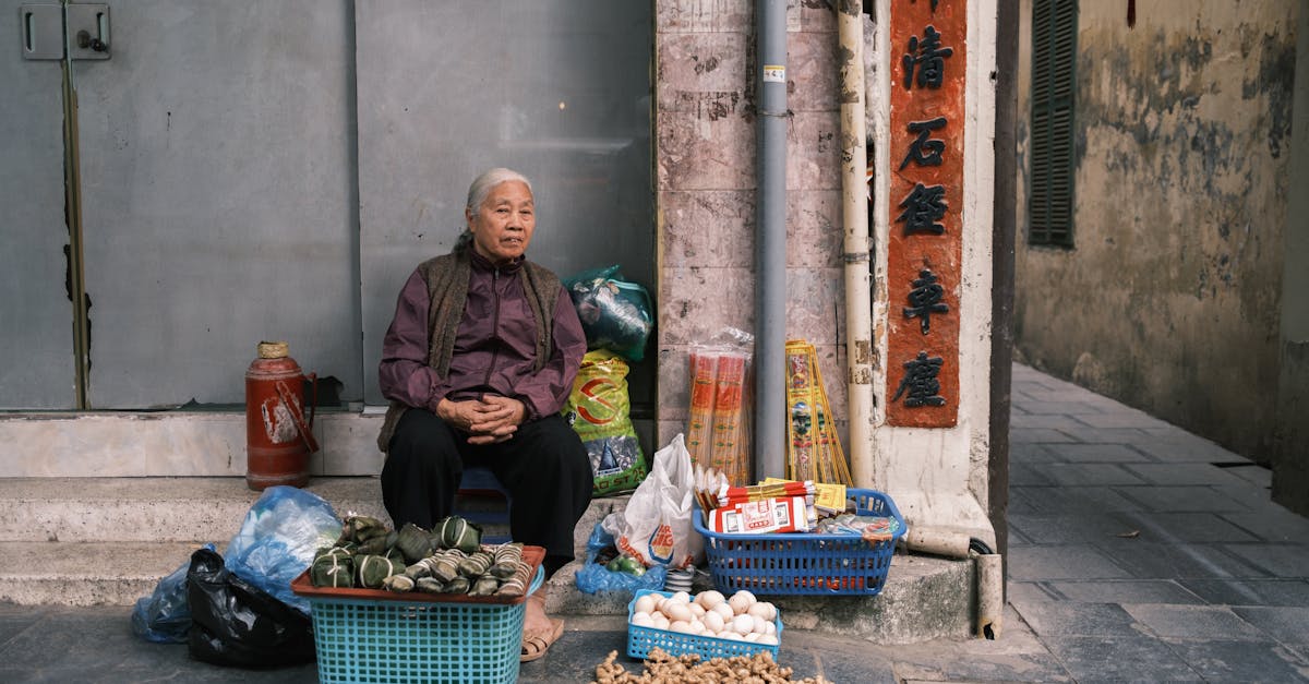 Woman Sitting and Selling Food on a Street Corner · Free Stock Photo