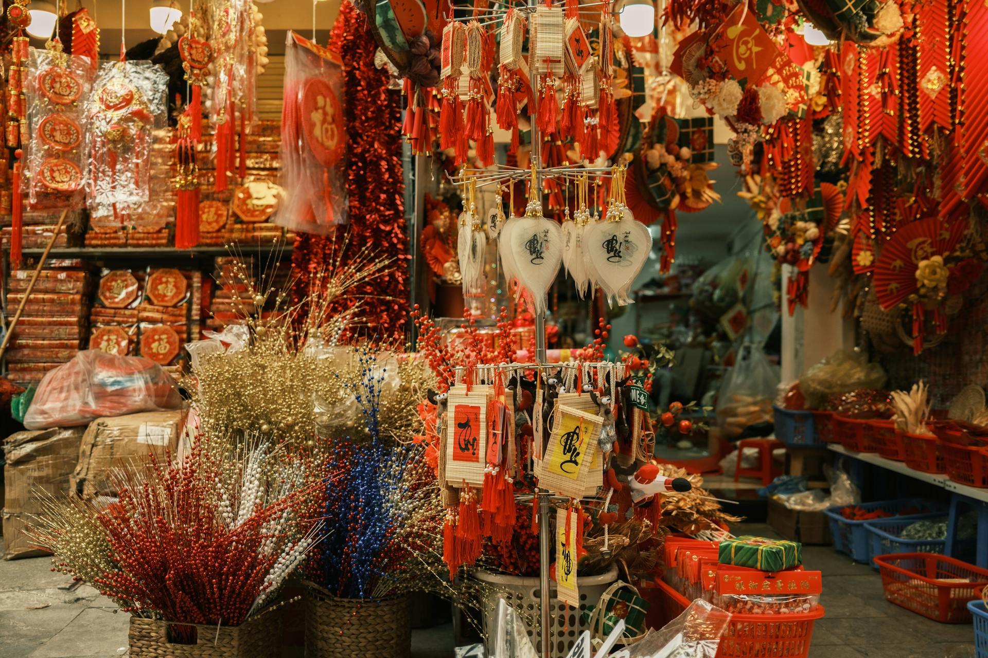 Explore a colorful market stall featuring traditional Chinese decor, rich in cultural elements and vibrant festive items.