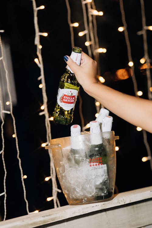 A Person Holding a Beer Bottle