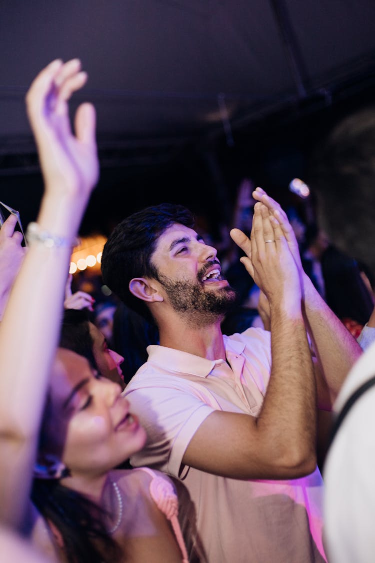 A Man Clapping In The Concert