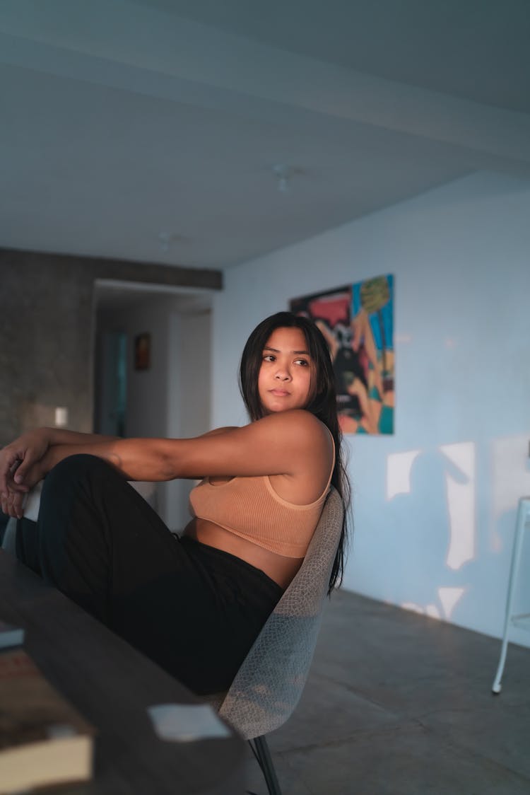 Brunette Woman Sitting On Chair