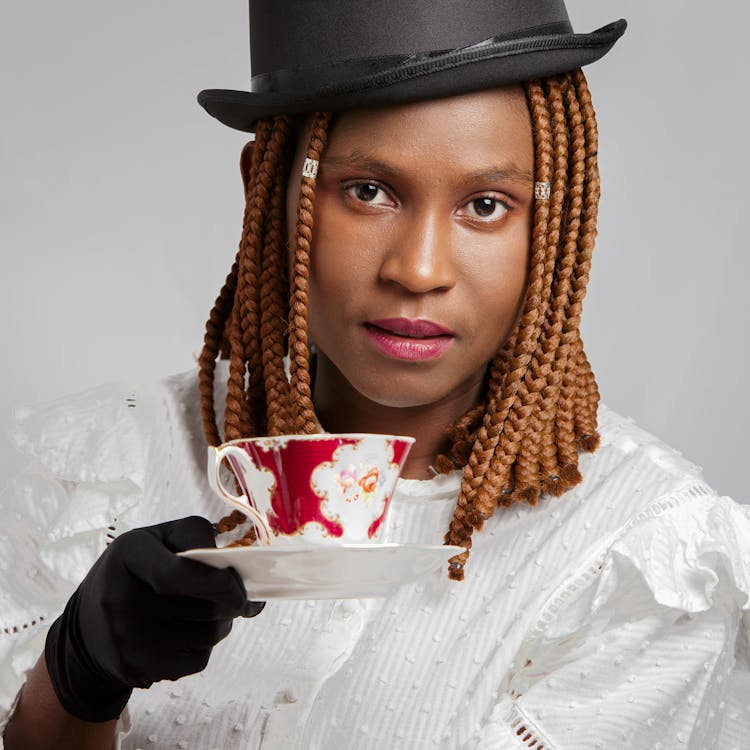 Woman Holding A Saucer And Teacup