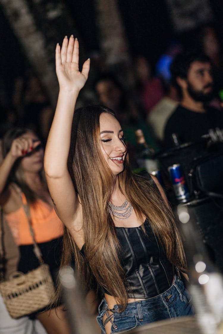 Young Woman Dancing In Nightclub