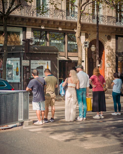 Photo of People Waiting at a Zebra Crossing in Paris, France