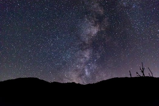 Breathtaking view of the Milky Way over Joshua Tree's rugged landscape.