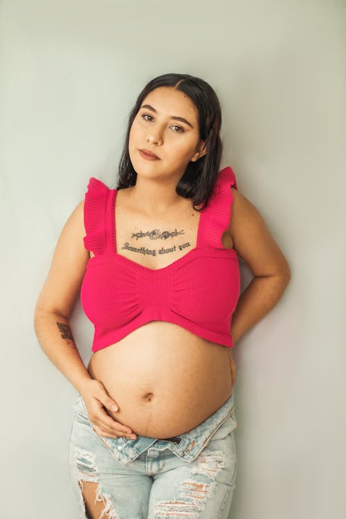 Pregnant Woman Wearing a Pink Tank Top