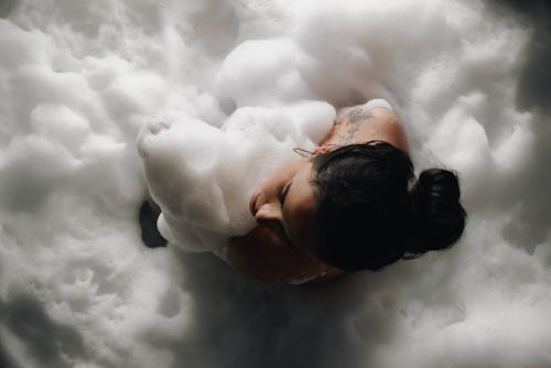 Woman Bathing in Foam 
