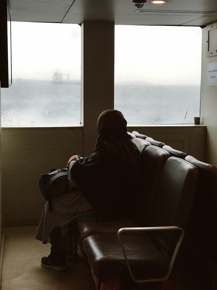 Woman Sitting On Vessel