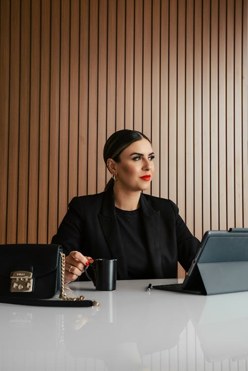Free Woman Sitting in an Office  Stock Photo