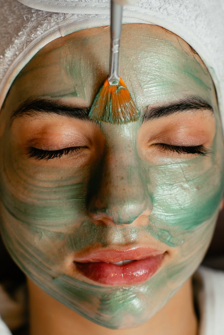 Woman Getting A Face Mask Done