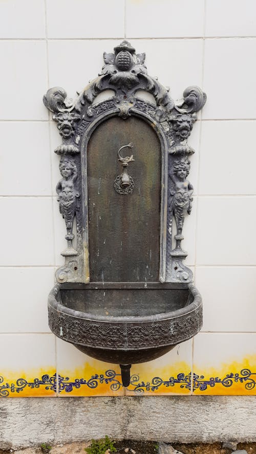 An Old Cast Iron Wall Water Fountain