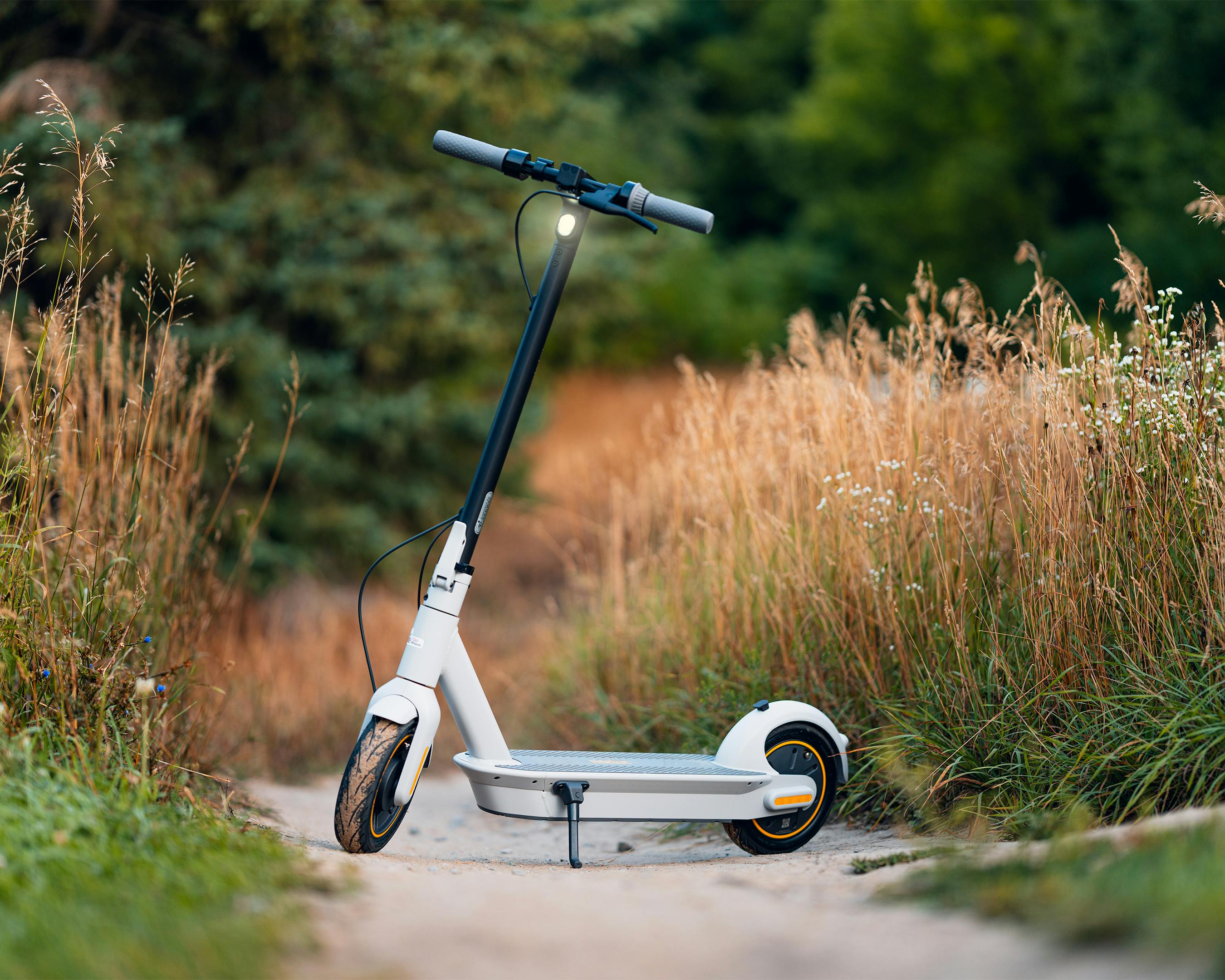 Photo of a Electric Scooter Standing on a Rural Side Way · Free Stock Photo