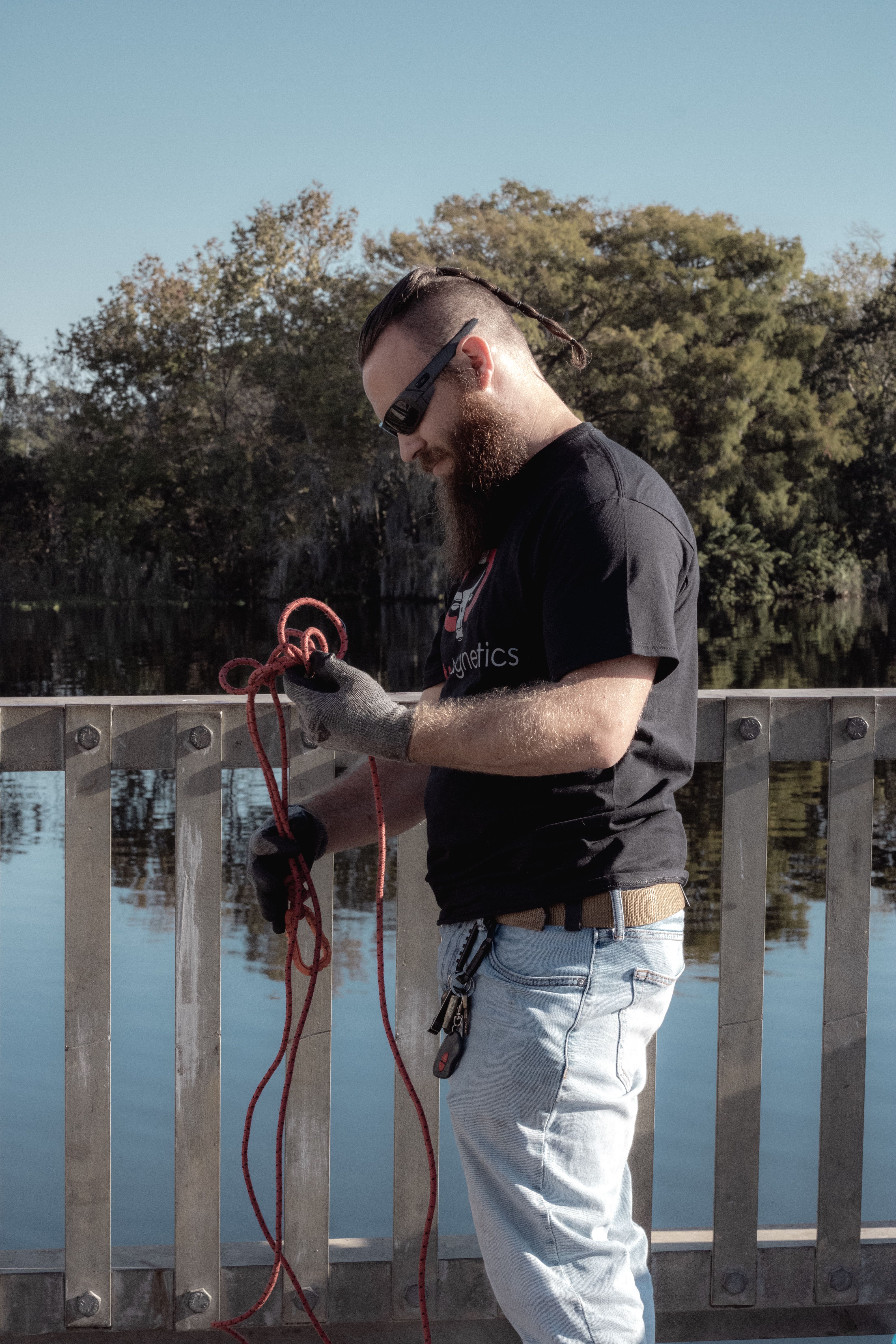 Man Standing on the Bridge and Holding a Rope · Free Stock Photo