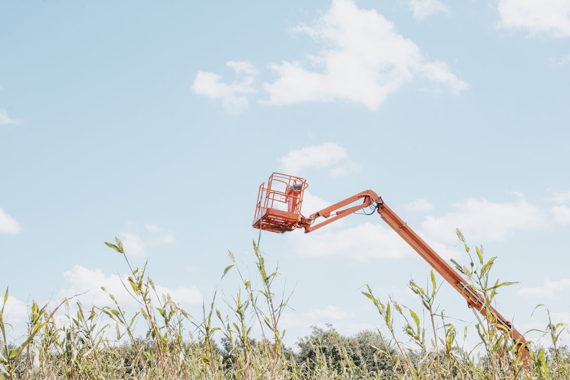 Boom with Lift Bucket in an Agricultural Field