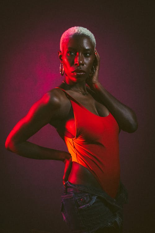 Model Posing in red Bodysuit