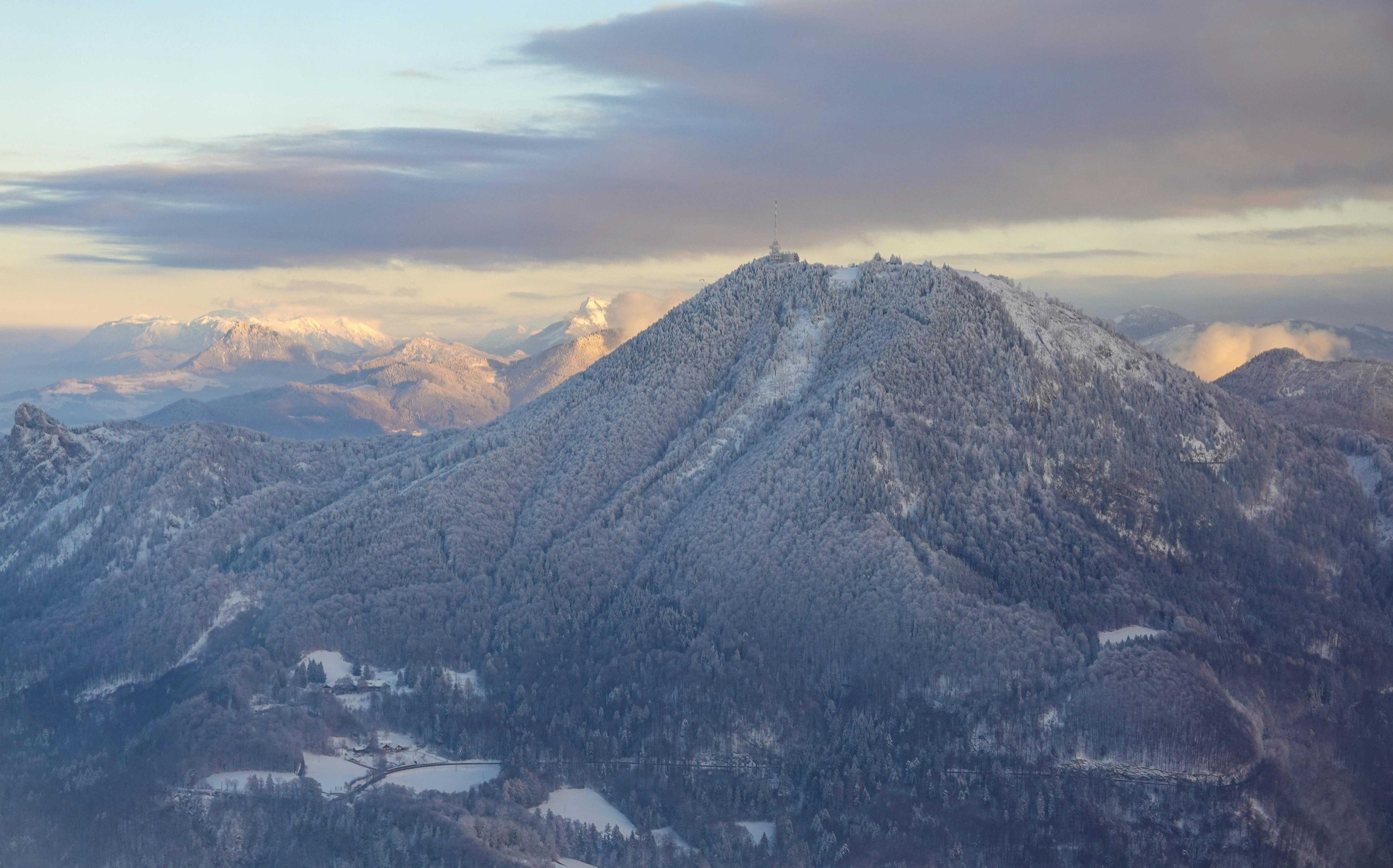 Stunning aerial view of snow-capped mountains in Salzburg, Austria during winter.