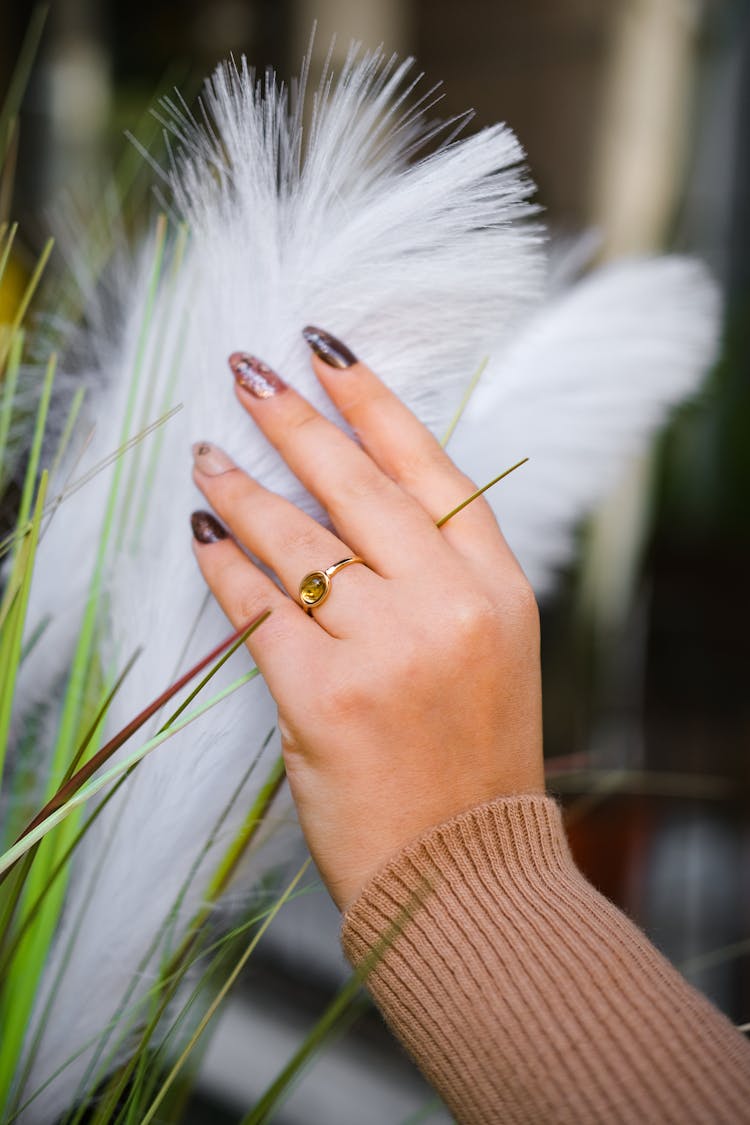 Hand Of A Woman With Painted Nails 