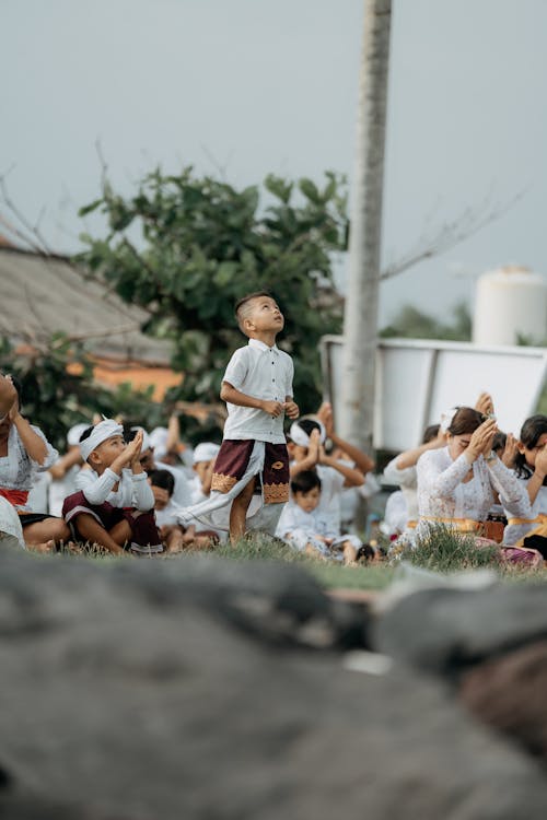 Free Children Praying on Grass Stock Photo